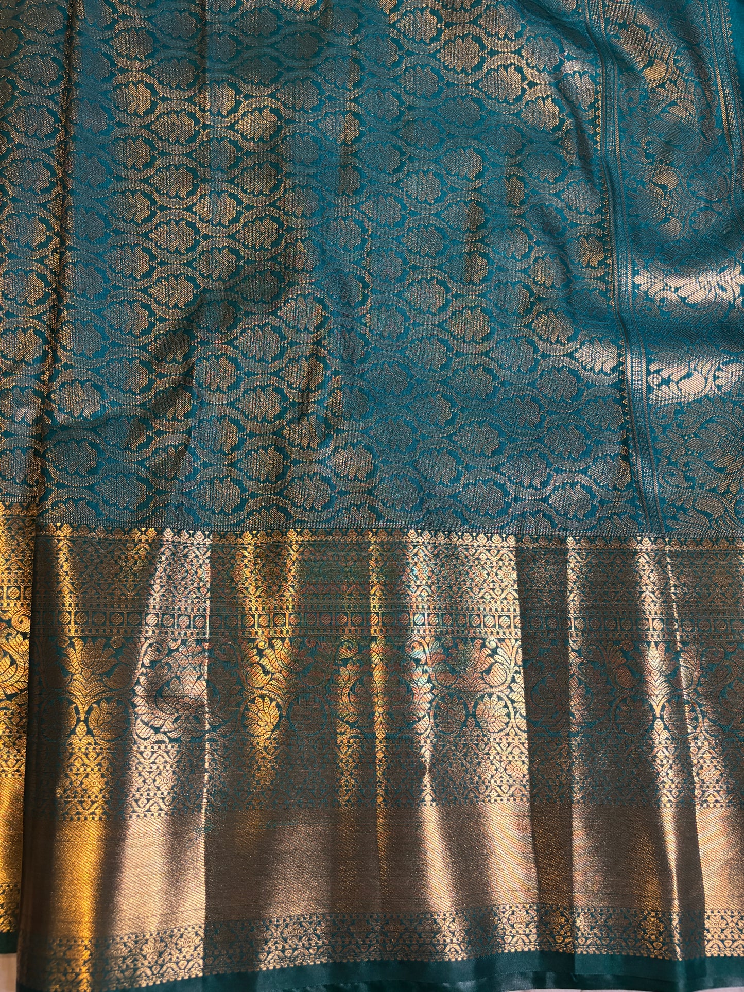 Elegant Purple Sari with Gold Accents and Green Border