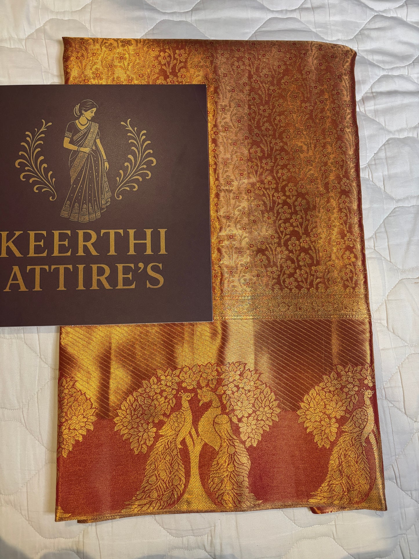 Elegant Orange Sari with Peacock Design