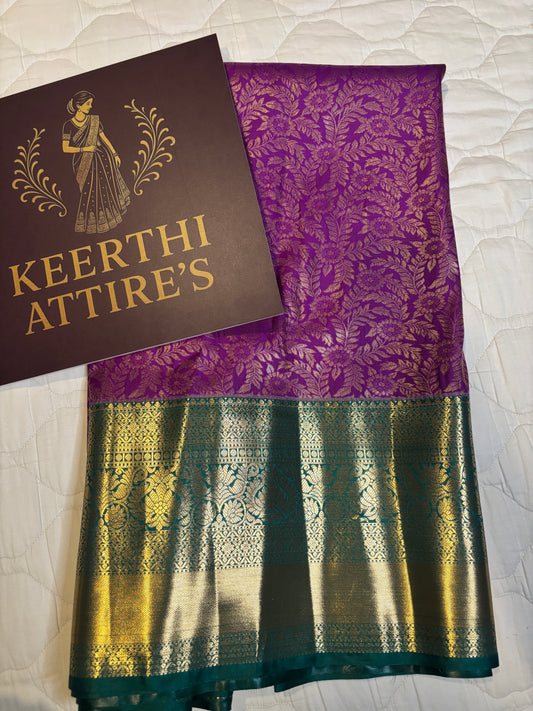 Elegant Purple Sari with Gold Accents and Green Border