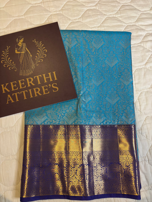 Turquoise Kanchipuram Silk Saree with Golden Floral Motifs and Dark Blue Border