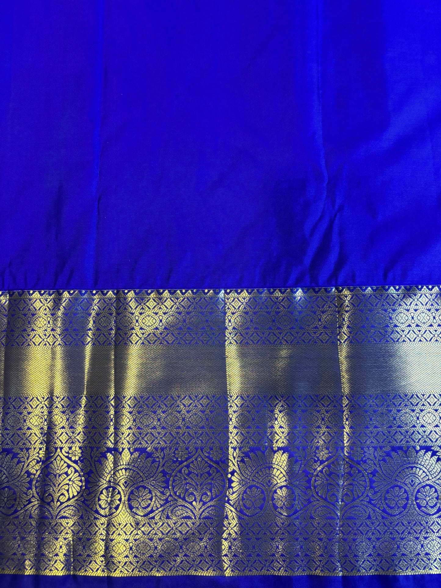 Turquoise Kanchipuram Silk Saree with Golden Floral Motifs and Dark Blue Border