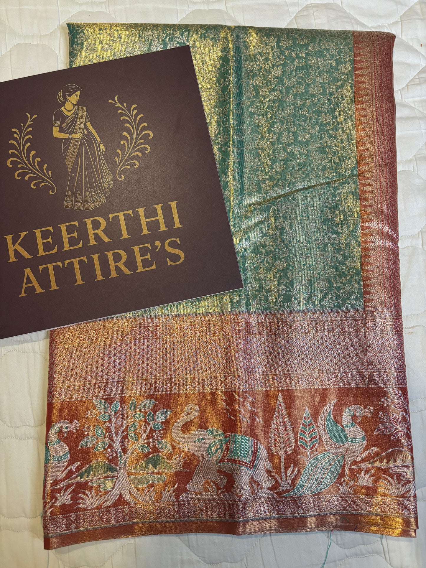 Teal Sari with Vibrant Orange Border and peacock- Elephant Motif