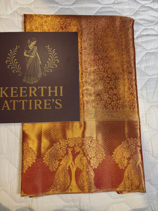 Elegant Orange Sari with Peacock Design